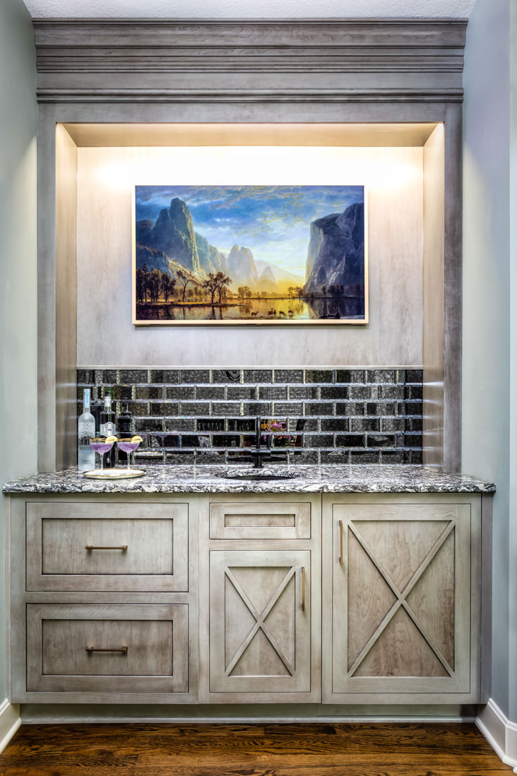Beautiful cabinetry, carpentry, and tile work are the focal points of this wonderful wetbar